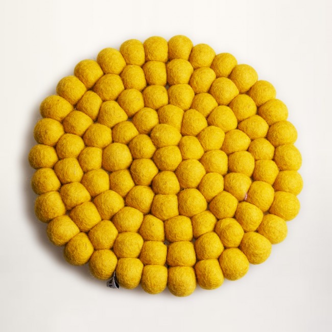 yellow trivet the felt balls