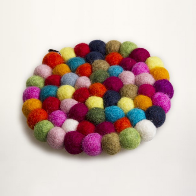 multicolored coaster of felt balls